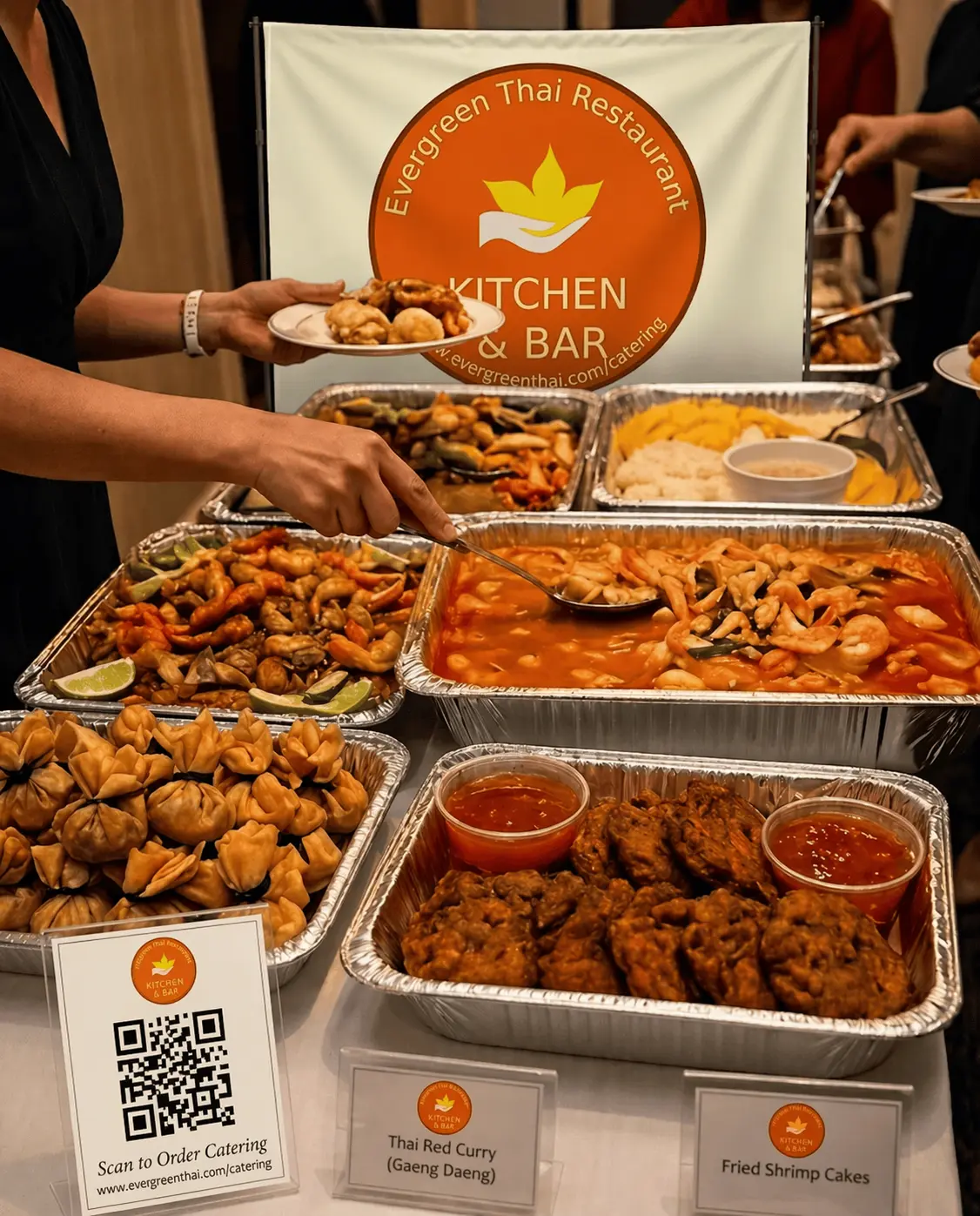 Labeled Evergreen Thai catering trays arranged for pickup and group orders